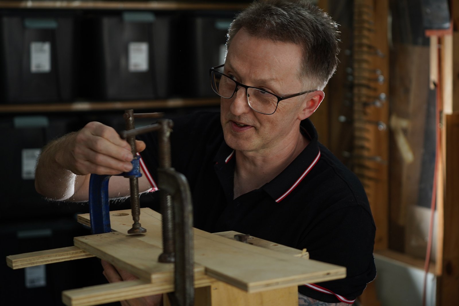 Photo of Nigel Forster at the workshop bench